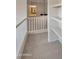 Hallway with neutral carpet, white railings, and shelving is naturally illuminated at 3614 W Alyssa Ln, Phoenix, AZ 85083