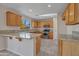 Bright kitchen featuring granite countertops, stainless steel appliances, and tile flooring at 3614 W Alyssa Ln, Phoenix, AZ 85083