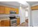 Well-equipped kitchen featuring stainless steel appliances and granite countertops at 3614 W Alyssa Ln, Phoenix, AZ 85083