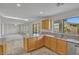 Bright kitchen featuring granite countertops, wood cabinets, and stainless steel appliances at 3614 W Alyssa Ln, Phoenix, AZ 85083