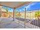 Covered patio area with a fenced view of the sparkling in-ground pool and desert landscaping at 3614 W Alyssa Ln, Phoenix, AZ 85083