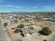 An aerial perspective of horse property featuring extensive facilities, including a pool and surrounding houses at 3720 E Vista Grande --, San Tan Valley, AZ 85140