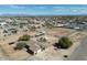 Aerial view of a property showcasing extensive horse facilities, a pool, and residential buildings at 3720 E Vista Grande --, San Tan Valley, AZ 85140