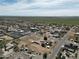 Aerial view of a desert community showcasing a home, horse facilities, and expansive greenery nearby at 3720 E Vista Grande --, San Tan Valley, AZ 85140