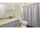 Bathroom featuring granite countertops, modern fixtures, and a shower with a gray curtain for privacy at 3720 E Vista Grande --, San Tan Valley, AZ 85140