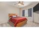 Comfortable bedroom featuring a ceiling fan, plush carpet, and a large window with light-blocking curtains at 3720 E Vista Grande --, San Tan Valley, AZ 85140