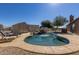 Sparkling in-ground pool with waterfall feature, tanning ledge, and comfortable patio furniture at 3720 E Vista Grande --, San Tan Valley, AZ 85140