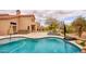 Backyard with pool, hot tub, putting green, and basketball hoop at 4365 E Milton Dr, Cave Creek, AZ 85331