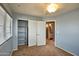 Bright bedroom with a view of the ensuite bathroom, featuring neutral walls, carpet and a closet with sliding doors at 4365 E Milton Dr, Cave Creek, AZ 85331