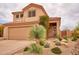 Charming two-story home with a desert landscape and a spacious two-car garage, creating a welcoming curb appeal at 4365 E Milton Dr, Cave Creek, AZ 85331