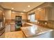 Kitchen featuring granite countertops and stainless steel appliances and light wood cabinets at 4365 E Milton Dr, Cave Creek, AZ 85331