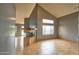 Modern living room with high ceilings, tiled flooring, and stylish fireplace creating a comfortable and spacious ambiance at 4365 E Milton Dr, Cave Creek, AZ 85331