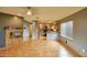 Living room with an open layout to the kitchen featuring tile floors and a fireplace at 4365 E Milton Dr, Cave Creek, AZ 85331