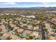 An aerial view of a desert neighborhood featuring various home styles and community amenities at 4607 E Rancho Laredo Dr, Cave Creek, AZ 85331