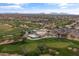 Beautiful aerial view of the golf course showcasing the clubhouse, pool, and surrounding desert homes at 4607 E Rancho Laredo Dr, Cave Creek, AZ 85331