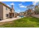 Spacious backyard featuring a pool, patio, and a grassy area, perfect for outdoor activities at 4607 E Rancho Laredo Dr, Cave Creek, AZ 85331