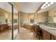 Elegant bathroom with dual vanities, a luxurious soaking tub, and a glass-enclosed shower at 4607 E Rancho Laredo Dr, Cave Creek, AZ 85331