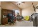 Bedroom with a desk, office chair, ceiling fan, and a large window overlooking the exterior at 4607 E Rancho Laredo Dr, Cave Creek, AZ 85331