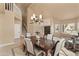 A dining room with high ceilings features a chandelier and an adjacent staircase at 4607 E Rancho Laredo Dr, Cave Creek, AZ 85331