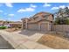 Two-story home featuring a neutral stucco exterior, tile roof, and a spacious three-car garage at 4607 E Rancho Laredo Dr, Cave Creek, AZ 85331