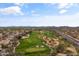 Picturesque aerial view of the golf course, featuring lush green fairways, sand traps, and scenic desert landscaping at 4607 E Rancho Laredo Dr, Cave Creek, AZ 85331