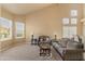 Cozy living room featuring neutral tones, large windows, and comfortable seating at 4607 E Rancho Laredo Dr, Cave Creek, AZ 85331