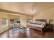 Spacious main bedroom features hardwood floors, a ceiling fan, and large windows offering ample natural light at 4607 E Rancho Laredo Dr, Cave Creek, AZ 85331