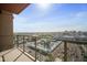 A balcony overlooking the city on a clear day with a metal fence at 4750 N Central Ave # 12H, Phoenix, AZ 85012