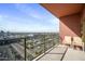 A balcony featuring chairs and a view of the city on a clear and sunny day at 4750 N Central Ave # 12H, Phoenix, AZ 85012