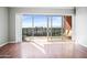 Living room with sliding glass doors to a balcony and a stunning city view at 4750 N Central Ave # 12H, Phoenix, AZ 85012