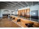 Modern bar area features a marble countertop, wood cabinetry, pendant lighting, and stylish seating at 4750 N Central Ave # 12H, Phoenix, AZ 85012