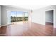 Living room with gleaming floors and sliding glass doors with a city view at 4750 N Central Ave # 12H, Phoenix, AZ 85012