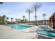 A refreshing pool area with inviting lounge chairs and towering palm trees at 4750 N Central Ave # 12H, Phoenix, AZ 85012