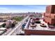 Community rooftop patio with tables and chairs overlooking the city at 4750 N Central Ave # 12H, Phoenix, AZ 85012