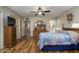 Open bedroom featuring wood floors, a ceiling fan, and a neutral color palette at 518 S Racine --, Mesa, AZ 85206