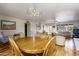 Bright dining room with hardwood floors and a view into the living area at 518 S Racine --, Mesa, AZ 85206