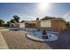 Inviting brick home with desert landscaping, featuring a covered porch and a charming front yard display at 518 S Racine --, Mesa, AZ 85206