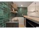 Close-up of wet bar with stainless sink, dark cabinets, and modern design at 5513 N 5Th Dr, Phoenix, AZ 85013