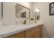 Bathroom vanity featuring modern fixtures, quartz countertops, and wood-look cabinets at 5513 N 5Th Dr, Phoenix, AZ 85013