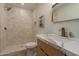 Updated bathroom with sleek shower, elegant vanity with stylish sink and modern fixtures at 5513 N 5Th Dr, Phoenix, AZ 85013