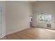 Empty bedroom with wood-look floors and plenty of natural light at 5513 N 5Th Dr, Phoenix, AZ 85013