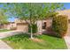 Inviting single-story home with a two-car garage, gated courtyard, and lush green lawn at 5513 N 5Th Dr, Phoenix, AZ 85013