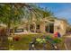 Backyard featuring grass, shaded patio, a slide, and climbing dome at 5771 W Gail Dr, Chandler, AZ 85226