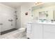 Modern bathroom with marble walk-in shower, stylish fixtures, and bright lighting at 5771 W Gail Dr, Chandler, AZ 85226