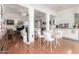 Bright dining room featuring hardwood floors and an open floor plan into the kitchen and living areas at 5771 W Gail Dr, Chandler, AZ 85226