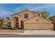 Inviting two-story home featuring a three-car garage and arched entryway at 5771 W Gail Dr, Chandler, AZ 85226