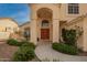 A welcoming front entrance with double wood doors and lovely landscaping at 5771 W Gail Dr, Chandler, AZ 85226