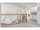 Hallway view showing storage cabinets and staircase below at 5771 W Gail Dr, Chandler, AZ 85226