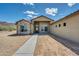 Charming single-story home featuring a neutral stucco exterior with stone accents, walkway, and mountain views at 6107 E Lone Mountain Rd, Cave Creek, AZ 85331