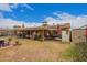 Covered back patio with ample seating and outdoor decor at 6225 W Marconi Ave, Glendale, AZ 85306